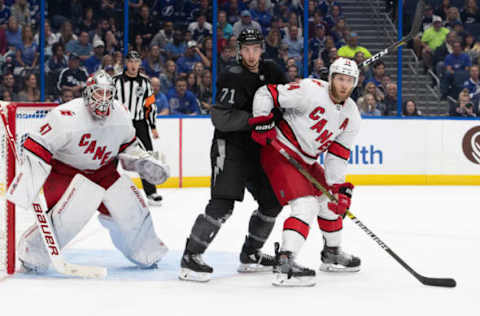 TAMPA, FL – NOVEMBER 30: Anthony Cirelli #71 of the Tampa Bay Lightning skates against James Reimer #47 and Jaccob Slavin #74 of the Carolina Hurricanes during the third period at Amalie Arena on November 30, 2019 in Tampa, Florida. (Photo by Scott Audette /NHLI via Getty Images)