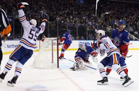 NEW YORK, NEW YORK – NOVEMBER 26: Dylan Holloway #55 of the Edmonton Oilers scores his first NHL goal during the third period against the New York Rangers at Madison Square Garden on November 26, 2022, in New York City. The Oilers defeated the Rangers 4-3. (Photo by Bruce Bennett/Getty Images)