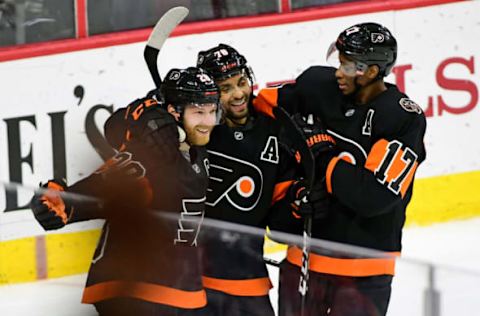 Mar 15, 2017; Philadelphia, PA, USA; Philadelphia Flyers center Claude Giroux (28) celebrates his goal with left wing Pierre-Edouard Bellemare (78) and right wing Wayne Simmonds (17) against the Pittsburgh Penguins during the third period at Wells Fargo Center. The Flyers defeated the Penguins, 4-0. Mandatory Credit: Eric Hartline-USA TODAY Sports