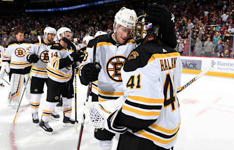 GLENDALE, ARIZONA – OCTOBER 05: Goalie Jaroslav Halak #41 of the Boston Bruins is congratulated by teammate Charlie Coyle #13 following a 1-0 victory against the Arizona Coyotes at Gila River Arena on October 05, 2019 in Glendale, Arizona. (Photo by Norm Hall/NHLI via Getty Images)