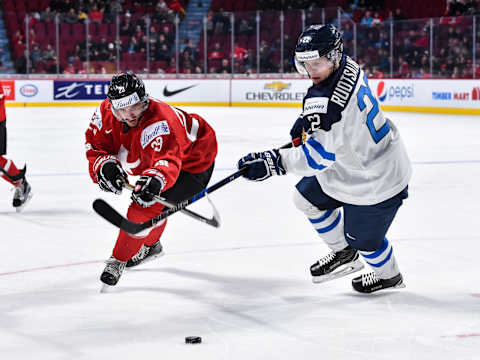 MONTREAL, QC – DECEMBER 31: Dominik Diem #23 of Team Switzerland and Arttu Ruotsalainen #22 of Team Finland chase the puck during the 2017 IIHF World Junior Championship preliminary round game at the Bell Centre on December 31, 2016 in Montreal, Quebec, Canada. (Photo by Minas Panagiotakis/Getty Images)