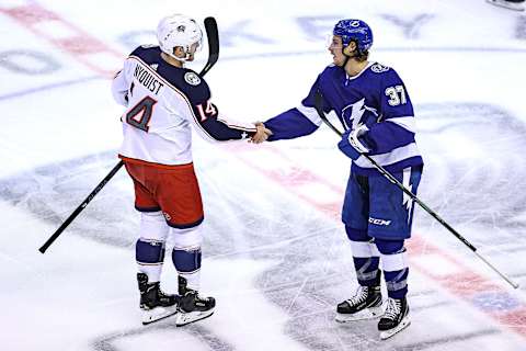 Gustav Nyquist #14 of the Columbus Blue Jackets and Yanni Gourde #37 of the Tampa Bay Lightning (Photo by Elsa/Getty Images)