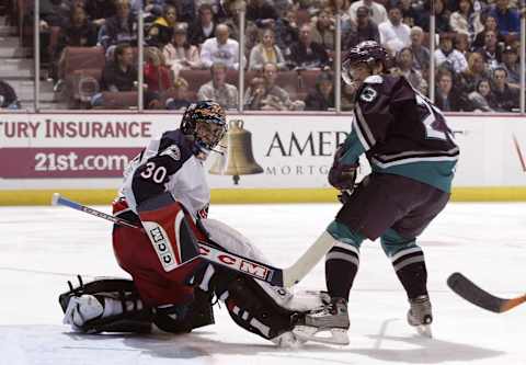 ANAHEIM, CA – JANUARY 11: Marc Denis #30 of the Columbus Blue Jackets makes a save off of Stanislav Christov #23 of the Anaheim Mighty Ducks in the third period during the game on January 11, 2003 at The Arrowhead Pond in Anaheim, California. The game ended in a 3-3 tie. (Photo by Harry How/Getty Images)