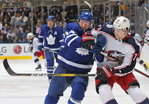 Josh Anderson of the Columbus Blue Jackets battles against Morgan Rielly of the Toronto Maple Leafs (Photo by Claus Andersen/Getty Images)