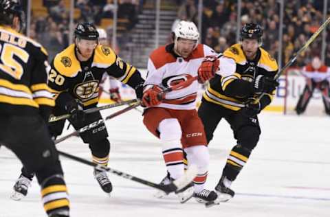 BOSTON, MA – JANUARY 6: Riley Nash #20 and David Backes #42 of the Boston Bruins fight for the puck against Justin Williams #14 of the Carolina Hurricanes at the TD Garden on January 6, 2018 in Boston, Massachusetts. (Photo by Steve Babineau/NHLI via Getty Images)