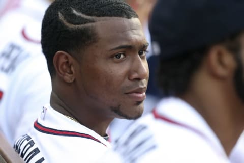 Jul 1, 2014; Atlanta, GA, USA; Atlanta Braves starting pitcher Julio Tehran (facing) talks with a teammate in the dugout during their game against the New York Mets at Turner Field. The Braves defeated the Mets 5-4. Mandatory Credit: Jason Getz-USA TODAY Sports