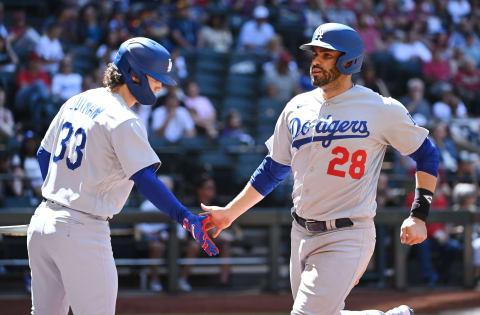 PHOENIX, ARIZONA – APRIL 09: JD Martinez #28 of the Los Angeles Dodgers celebrates with James Outman #33 after scoring on a sacrifice fly hit by Miguel Vargas #17 against the Arizona Diamondbacks during the third inning at Chase Field on April 09, 2023 in Phoenix, Arizona. (Photo by Norm Hall/Getty Images)