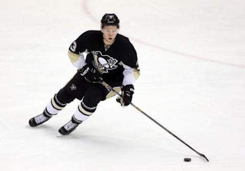 Feb 20, 2016; Pittsburgh, PA, USA; Pittsburgh Penguins defenseman Olli Maatta (3) skates with the puck against the Tampa Bay Lightning during the second period at the CONSOL Energy Center. Mandatory Credit: Charles LeClaire-USA TODAY Sports