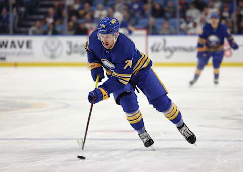 Nov 18, 2021; Buffalo, New York, USA; Buffalo Sabres right wing Rasmus Asplund (74) looks to take a shot on goal during the second period against the Calgary Flames at KeyBank Center. Mandatory Credit: Timothy T. Ludwig-USA TODAY Sports