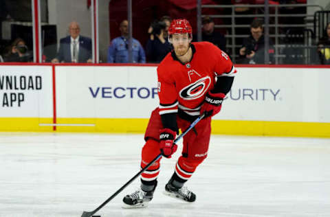 RALEIGH, NC – DECEMBER 28: Dougie Hamilton #19 of the Carolina Hurricanes looks to pass the puck during an NHL game against the Washington Capitals on December 28, 2019 at PNC Arena in Raleigh, North Carolina. (Photo by Gregg Forwerck/NHLI via Getty Images)