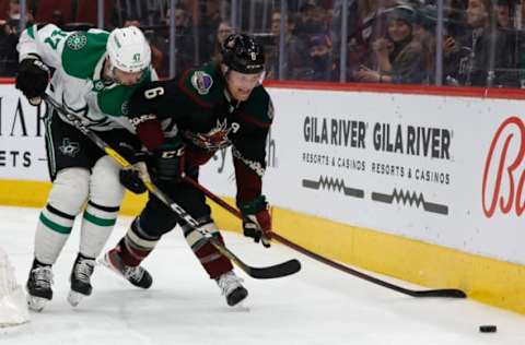 GLENDALE, ARIZONA – FEBRUARY 20: Jakob Chychrun #6 of the Arizona Coyotes skates with the puck ahead of Alexander Radulov #47 of the Dallas Stars during the NHL game at Gila River Arena on February 20, 2022, in Glendale, Arizona. The Coyotes defeated the Stars 3-1. (Photo by Christian Petersen/Getty Images)