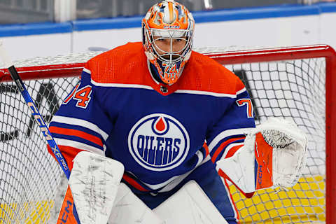 Nov 26, 2023; Edmonton, Alberta, CAN; Edmonton Oilers goaltender Stuart Skinner (74) makes a save during warmup against the Anaheim Ducks at Rogers Place. Mandatory Credit: Perry Nelson-USA TODAY Sports