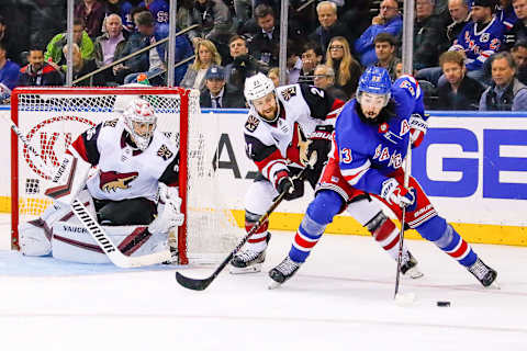 NEW YORK, NY – OCTOBER 22: New York Rangers center Mika Zibanejad (93) skates with the puck as Arizona Coyotes center Derek Stepan (21) defends and Arizona Coyotes goaltender Darcy Kuemper (35) tracks the play during the Arizona Coyotes and New York Rangers NHL game on October 22, 2019, at Madison Square Garden in New York, NY. (Photo by John Crouch/Icon Sportswire via Getty Images)