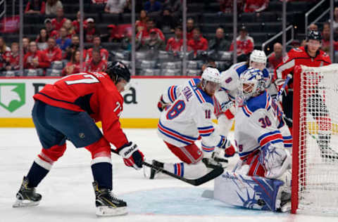 WASHINGTON, DC – OCTOBER 18: Henrik Lundqvist #30 of the New York Rangers makes a save against T.J. Oshie #77 of the Washington Capitals in the first period at Capital One Arena on October 18, 2019 in Washington, DC. (Photo by Patrick McDermott/NHLI via Getty Images)