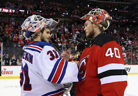 Igor Shesterkin of the Rangers congratulates Akira Schmid of the Devils. (Photo by Bruce Bennett/Getty Images)