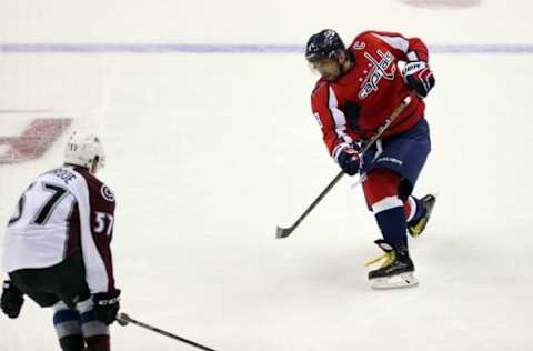 NHL Power Rankings: Washington Capitals left wing Alex Ovechkin (8) shoots the puck as Colorado Avalanche left wing Gabriel Bourque (57) defends in the third period at Verizon Center. The Capitals won 3-0. Mandatory Credit: Geoff Burke-USA TODAY Sports