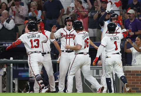 ATLANTA, GA – OCTOBER 07: Ronald Acuna Jr. #13 of the Atlanta Braves celebrates with teammates after hitting a grand slam in the second inning against the Los Angeles Dodgers during Game Three of the National League Division Series at SunTrust Park on October 7, 2018 in Atlanta, Georgia. (Photo by Rob Carr/Getty Images)