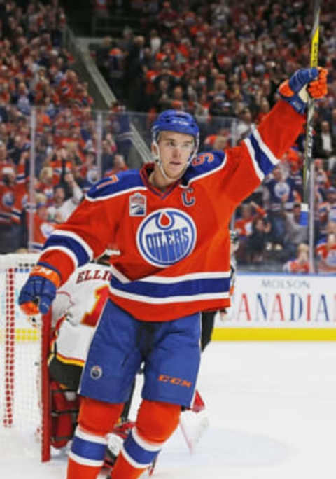 Oct 12, 2016; Edmonton, Alberta, CAN; Edmonton Oilers forward Connor McDavid (97) celebrates a psecond period penalty shot gaol against the Calgary Flames goaltender Brian Elliott (1) at Rogers Place. Mandatory Credit: Perry Nelson-USA TODAY Sports