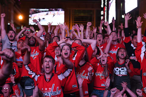 WASHINGTON, DC – JUNE 07: Washington Capitals fan, Mackenzie Frazier and others react to the Capitals first goal during game 5 of the NHL Stanley Cup Finals between the Capitals and Vegas Golden Knights near Capital One Arena on Thursday June 07, 2018 in Washington, DC. (Photo by Matt McClain/The Washington Post via Getty Images)