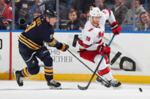 BUFFALO, NY – NOVEMBER 14: Jack Eichel #9 of the Buffalo Sabres skates against Dougie Hamilton #19 of the Carolina Hurricanes during an NHL game on November 14, 2019 at KeyBank Center in Buffalo, New York. (Photo by Bill Wippert/NHLI via Getty Images)