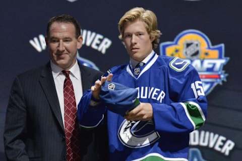 Jun 26, 2015; Sunrise, FL, USA; Brock Boeser adjusts his cap after being selected as the number twenty-three overall pick to the Vancouver Canucks in the first round of the 2015 NHL Draft at BB&T Center. Mandatory Credit: Steve Mitchell-USA TODAY Sports