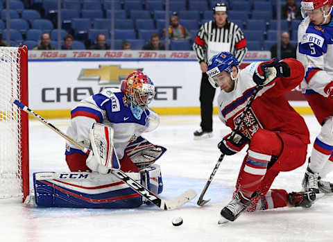 Alexei Melnichuk of Russia makes the save against Daniel Kurovsky of the Czech Republic during the second period at KeyBank Center on December 26, 2017 in Buffalo.