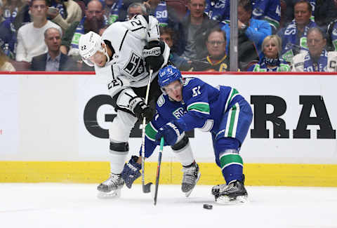 Trevor Lewis #22 of the Los Angeles Kings fights for the puck against Troy Stetcher #51 of the Vancouver Canucks (Photo by Ben Nelms/Getty Images)