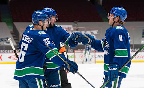 VANCOUVER, BC – MAY 03: J.T. Miller #9 of the Vancouver Canucks celebrates with teammates Nils Hoglander #36 and Brock Boeser #6. (Photo by Rich Lam/Getty Images)