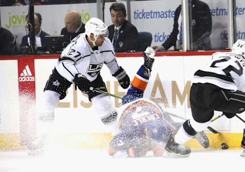 NEW YORK, NEW YORK – FEBRUARY 06: Jordan Eberle #7 of the New York Islanders is tripped up by Alec Martinez #27 of the Los Angeles Kings during the first period at the Barclays Center on February 06, 2020 in the Brooklyn borough of New York City. (Photo by Bruce Bennett/Getty Images)