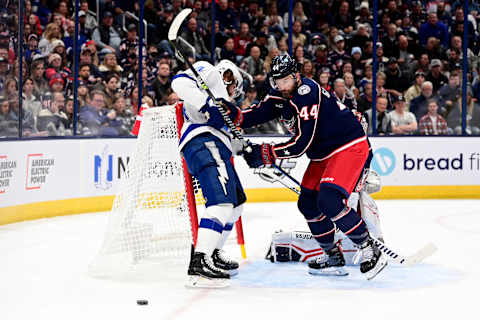 COLUMBUS, OHIO – OCTOBER 14: Erik Gudbranson #44 of the Columbus Blue Jackets and Pat Maroon #14 of the Tampa Bay Lightning compete for the puck during the first period at Nationwide Arena on October 14, 2022 in Columbus, Ohio. (Photo by Emilee Chinn/Getty Images)