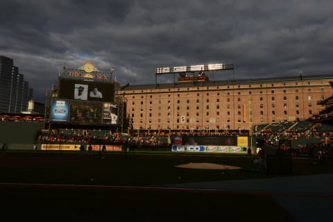 BALTIMORE, MD – SEPTEMBER 29, 2012: The West wall of the warehouse building bears the uniform number of Baseball Hall of Famer Broooks Robinson as the video screen and digitial message boards show images from his playing career and broadcast the unveiling ceremonies for a bronze statue in Robinson’s honor in the centerfield court prior to a game on September 29, 2012 between the Boston Red Sox and the Baltimore Orioles at Oriole Park in Baltimore, MD. (Photo by: Diamond Images/Getty Images)