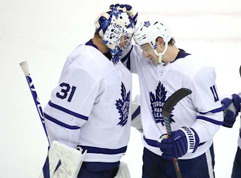 TORONTO, ONTARIO – JULY 28: Frederik Andersen #31 of the Toronto Maple Leafs is congratulated by teammate Zach Hyman #11 after the 4-2 win over the Montreal Canadiens during an exhibition game prior to the 2020 NHL Stanley Cup Playoffs at Scotiabank Arena on July 28, 2020 in Toronto, Ontario. (Photo by Andre Ringuette/Freestyle Photo/Getty Images)