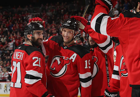 Kyle Palmieri #21 and Travis Zajac #19 of the New Jersey Devils (Photo by Bruce Bennett/Getty Images)