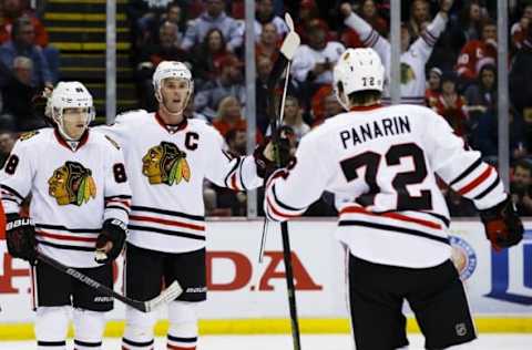 NHL Line Projections: Chicago Blackhawks left wing Artemi Panarin (72) receives congratulations from right wing Patrick Kane (88) and center Jonathan Toews (19) after scoring in the second period against the Detroit Red Wings at Joe Louis Arena. Mandatory Credit: Rick Osentoski-USA TODAY Sports