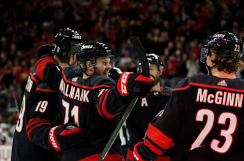 RALEIGH, NC – JANUARY 10: Lucas Wallmark #71 of the Carolina Hurricanes celebrates with teammates after scoring a goal during an NHL game against the Arizona Coyotes on January 10, 2020 at PNC Arena in Raleigh, North Carolina. (Photo by Gregg Forwerck/NHLI via Getty Images)