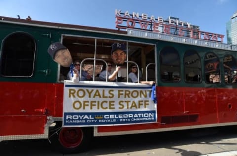 Nov 3, 2015; Kansas City, MO, USA; Members of the Kansas City Royals front office staff wave to the crowd at the World Series parade. Mandatory Credit: John Rieger-USA TODAY Sports