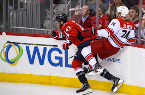 WASHINGTON, DC – APRIL 11: Washington Capitals right wing Tom Wilson (43) hits Carolina Hurricanes defenseman Jaccob Slavin (74) in the third period on April 11, 2019, at the Capital One Arena in Washington, D.C. in the first round of the Stanley Cup Playoffs. (Photo by Mark Goldman/Icon Sportswire via Getty Images)