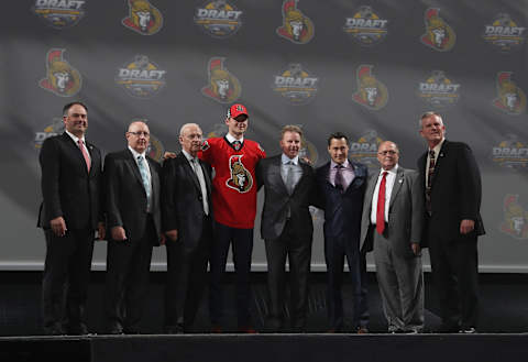 BUFFALO, NY – JUNE 24: Logan Brown, selected 11th overall by the Ottawa Senators, poses onstage with the Senators team personnel during round one of the 2016 NHL Draft at First Niagara Center on June 24, 2016 in Buffalo, New York. (Photo by Dave Sandford/NHLI via Getty Images)