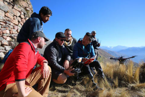 Thomas Hardy, Adan Choqque Arce, Joseph Steel, Duncan Lees, Albert Lin, and Alonso Arroyo launch the LIDAR drone at Wat'a in Peru.