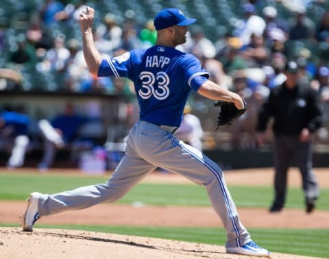 Jul 17, 2016; Oakland, CA, USA; Toronto Blue Jays starting pitcher J.A. Happ (33) pitches the ball against the Oakland Athletics during the first inning at O.co Coliseum. Mandatory Credit: Kelley L Cox-USA TODAY Sports