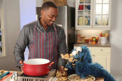 Actor Anthony Mackie with Cookie Monster.