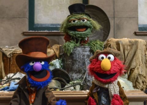 Grover, Oscar the Grouch, and Elmo.