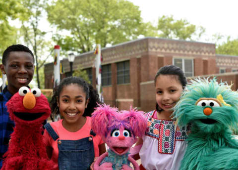 (L-R) Elmo, Abby Cadabby, and Rosita pose with fans.