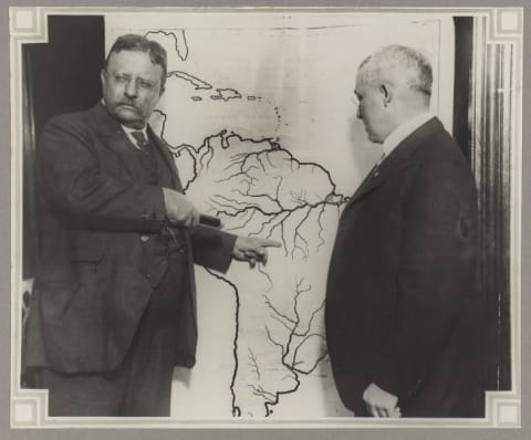 Sometime after his voyage on the SS Imperator, Roosevelt posed with a map of his expedition through the Amazon.