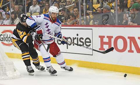 PITTSBURGH, PA – MAY 07: Patrik Nemeth #12 of the New York Rangers goes for a loose puck under pressure from Bryan Rust #17 of the Pittsburgh Penguins during the second period in Game Three of the First Round of the 2022 Stanley Cup Playoffs at PPG PAINTS Arena on May 7, 2022 in Pittsburgh, Pennsylvania. (Photo by Justin Berl/Getty Images)