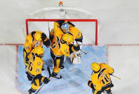 Nov 8, 2016; Nashville, TN, USA; Nashville Predators goalie Pekka Rinne (35) is congratulated by teammates after a win against the Ottawa Senators at Bridgestone Arena. The Predators won 3-1. Mandatory Credit: Christopher Hanewinckel-USA TODAY Sports