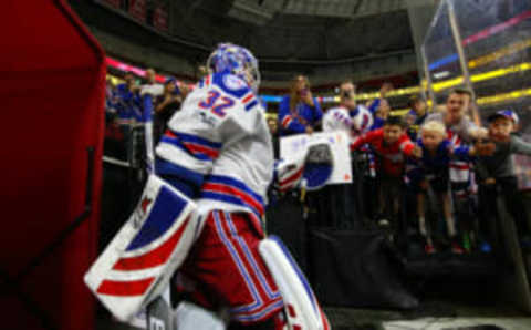 Mar 9, 2017; Raleigh, NC, USA; New York Rangers goalie Antti Raanta (32) goes past Ranger fans before the game against the Carolina Hurricanes at PNC Arena. The Hurricanes defeated the Rangers 4-3. Mandatory Credit: James Guillory-USA TODAY Sports