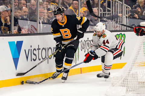 BOSTON, MA – DECEMBER 05: Boston Bruins right wing David Backes (42) skates with the puck as Chicago Blackhawks defenseman Calvin de Haan (44) defends during the Chicago Blackhawks and Boston Bruins NHL game on December 5, 2019, at TD Garden in Boston, MA. (Photo by John Crouch/Icon Sportswire via Getty Images)