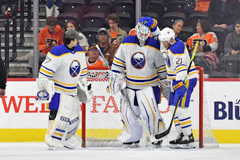 Apr 1, 2023; Philadelphia, Pennsylvania, USA; Buffalo Sabres goaltender Devon Levi (27), goaltender Ukko-Pekka Luukkonen (1) and right wing Kyle Okposo (21) celebrate win against the Philadelphia Flyers during the third period at Wells Fargo Center. Mandatory Credit: Eric Hartline-USA TODAY Sports