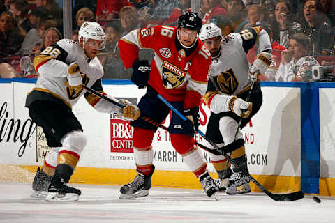 SUNRISE, FL – FEBRUARY 2: Aleksander Barkov #16 of the Florida Panthers crosses sticks with Paul Stastny #26 and teammate Alex Tuch #89 of the Vegas Golden Knights at the BB&T Center on February 2, 2019 in Sunrise, Florida. (Photo by Eliot J. Schechter/NHLI via Getty Images)